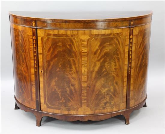 An Edwardian Sheraton revival rosewood banded and marquetry inlaid flame mahogany demi lune side cabinet, W.4ft 4in. D.1ft 9in. H.3ft 2